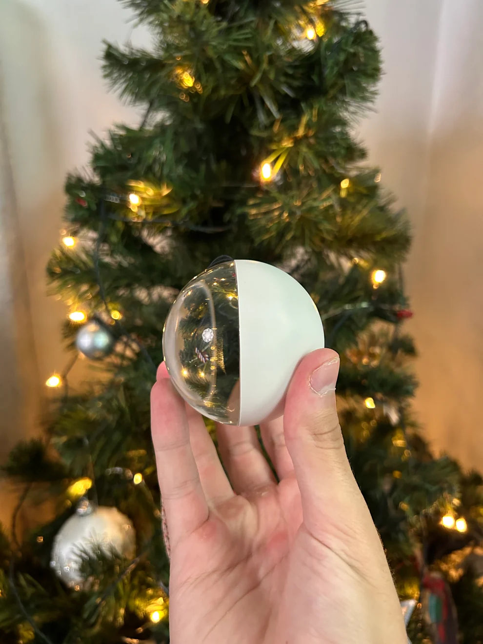 Glowmory ornament playing a family video